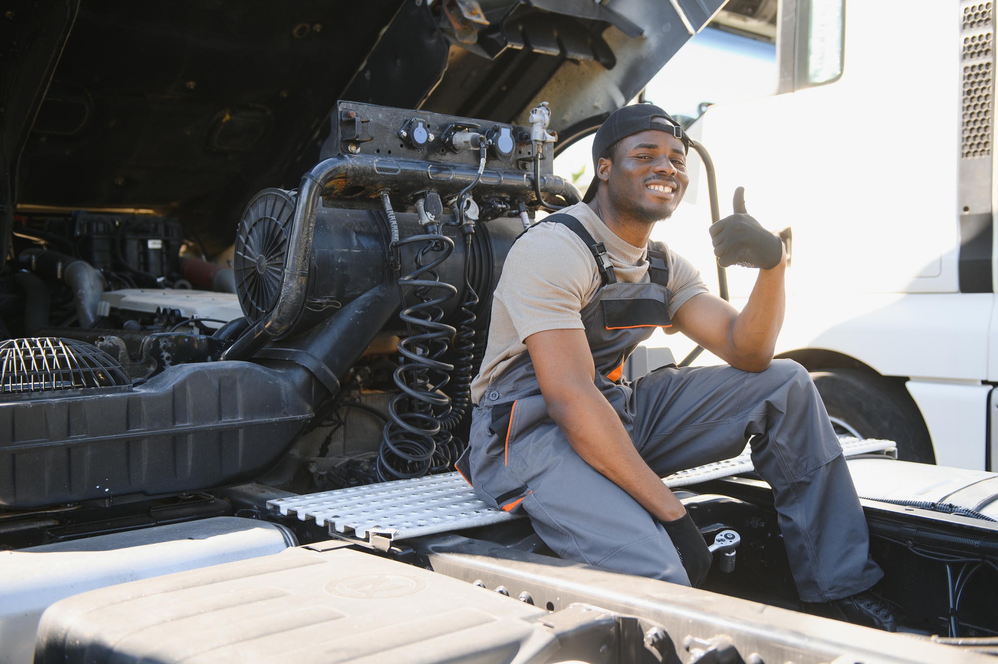 Professional Truck Mechanic Working In Vehicle Repair Service